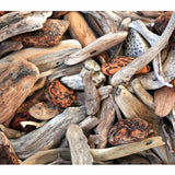 Driftwood Delight puzzle artwork of weathered driftwood and Petoskey stones