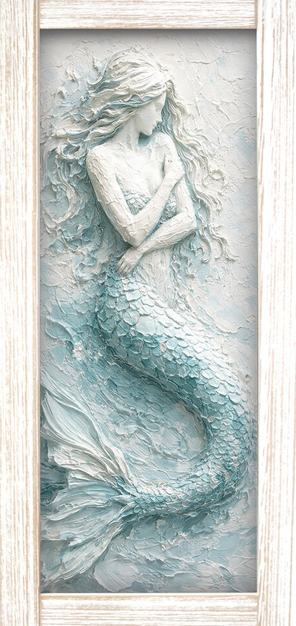 Print of a mermaid with flowing hair and tail in seafoam and white, shown in a light wood-tone frame.